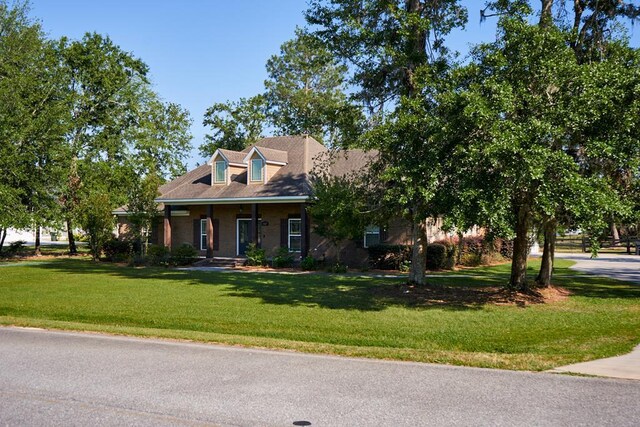 5527 School House Pond Rd, Lake Park, GA 31636 - cape cod house featuring covered porch and a front yard