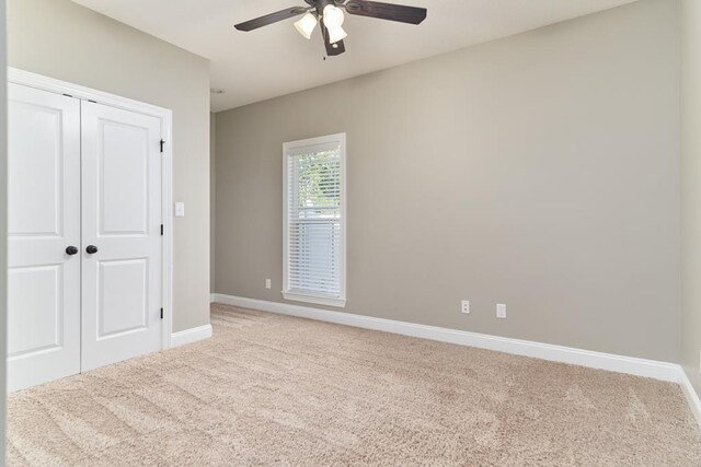 5527 School House Pond Rd, Lake Park, GA 31636 - unfurnished bedroom featuring light colored carpet, baseboards, a closet, and ceiling fan