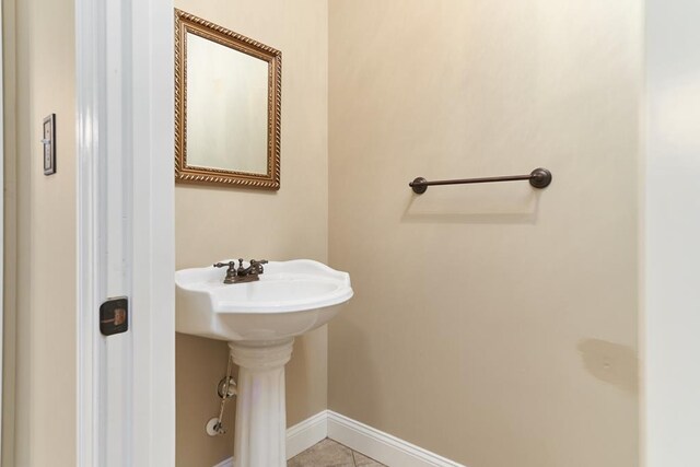 5527 School House Pond Rd, Lake Park, GA 31636 - bathroom featuring baseboards, a sink, and tile patterned flooring