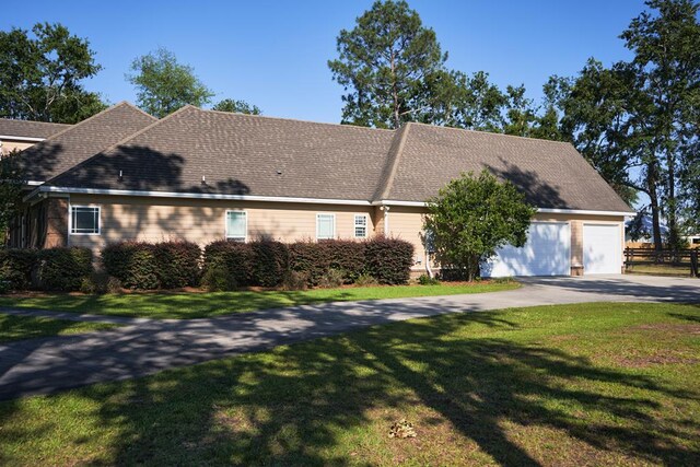 5527 School House Pond Rd, Lake Park, GA 31636 - view of front of house with a front lawn, an attached garage, and concrete driveway