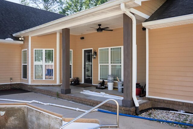 5527 School House Pond Rd, Lake Park, GA 31636 - view of exterior entry featuring ceiling fan, a shingled roof, and a patio area