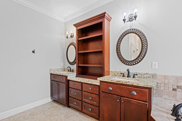 bathroom featuring built in shelves, crown molding, double vanity, a sink, and baseboards