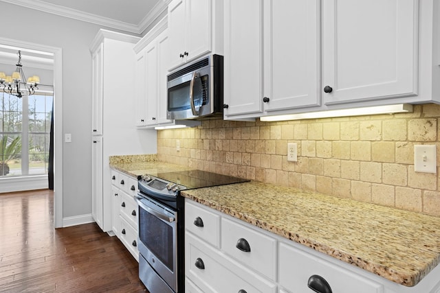 kitchen featuring dark wood finished floors, crown molding, tasteful backsplash, appliances with stainless steel finishes, and white cabinets