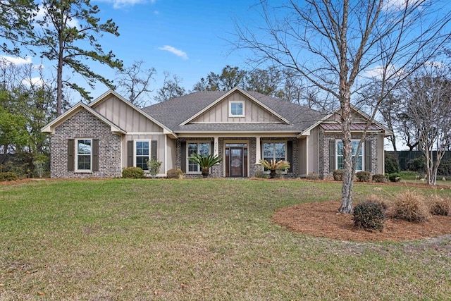 craftsman-style house with a front yard, brick siding, and board and batten siding