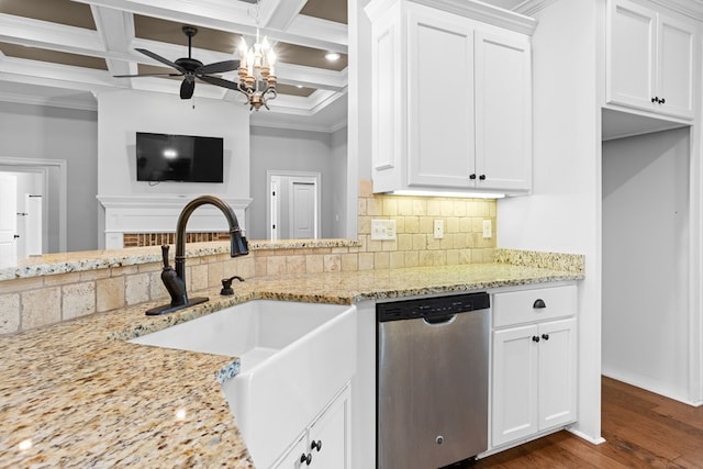 kitchen featuring light stone counters, a sink, ornamental molding, stainless steel dishwasher, and backsplash