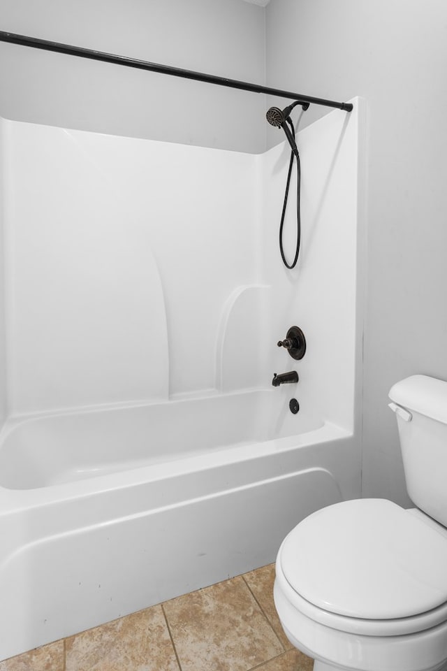 full bathroom with shower / bath combination, toilet, and tile patterned floors