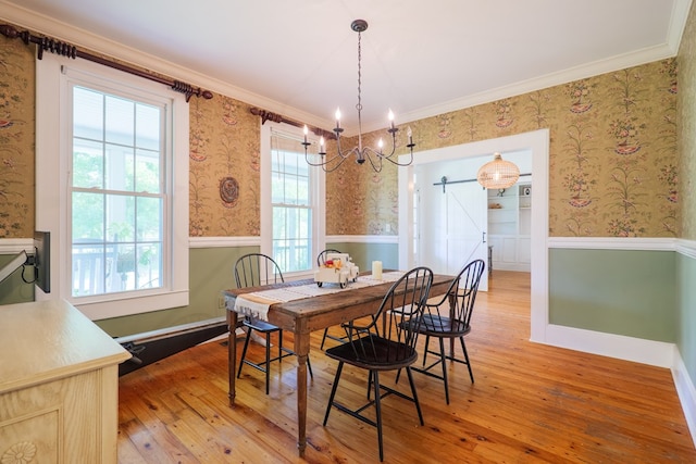 7552 Webb Rd, Hahira, GA 31632 - dining area featuring wainscoting, wallpapered walls, light wood-style floors, a chandelier, and plenty of natural light
