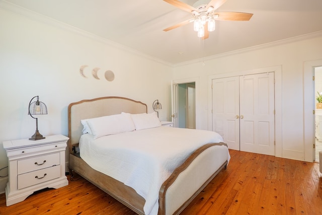 7552 Webb Rd, Hahira, GA 31632 - bedroom featuring ornamental molding, light wood-style floors, a closet, and ceiling fan