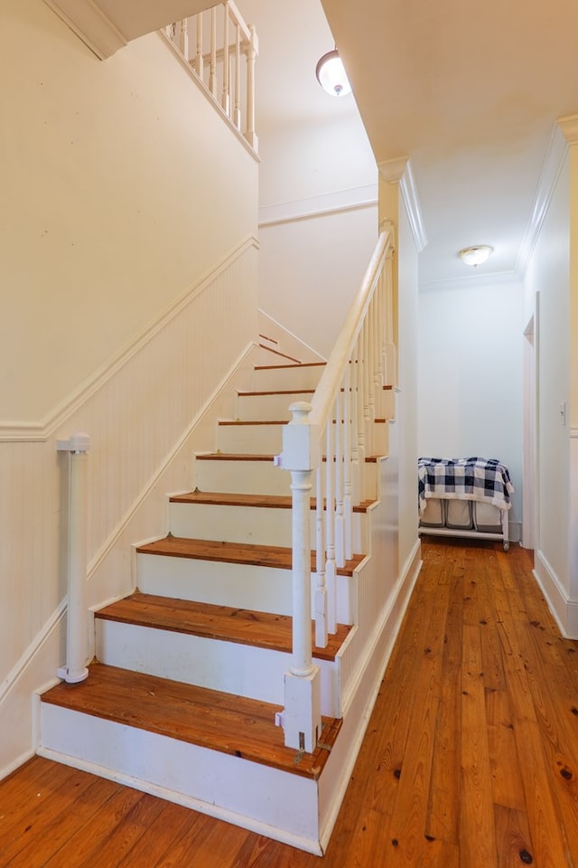 7552 Webb Rd, Hahira, GA 31632 - staircase featuring hardwood / wood-style flooring and ornamental molding