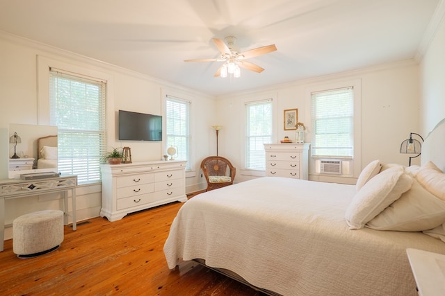 7552 Webb Rd, Hahira, GA 31632 - bedroom with crown molding, light wood-style floors, cooling unit, and a ceiling fan