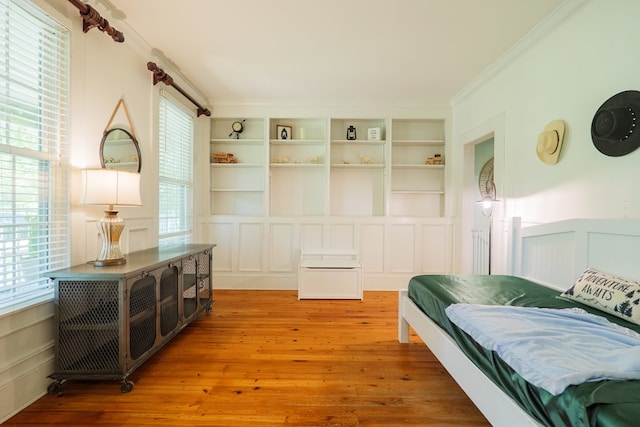 7552 Webb Rd, Hahira, GA 31632 - bedroom with crown molding, wood finished floors, and a decorative wall