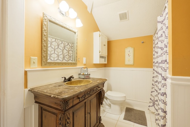7552 Webb Rd, Hahira, GA 31632 - bathroom with a wainscoted wall, vanity, lofted ceiling, tile patterned flooring, and curtained shower