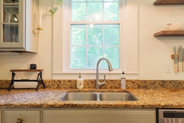 7552 Webb Rd, Hahira, GA 31632 - kitchen featuring white cabinetry, plenty of natural light, and glass insert cabinets