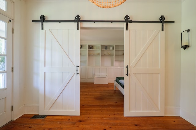 7552 Webb Rd, Hahira, GA 31632 - entrance foyer with a barn door and wood finished floors