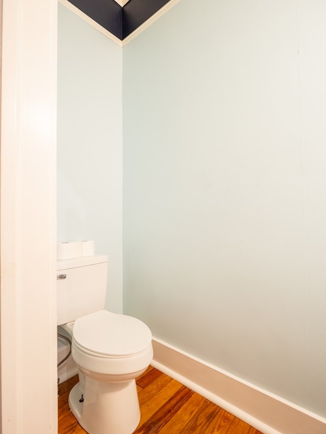 103 W Moore St, Valdosta, GA 31602 - bathroom featuring baseboards, wood finished floors, and toilet