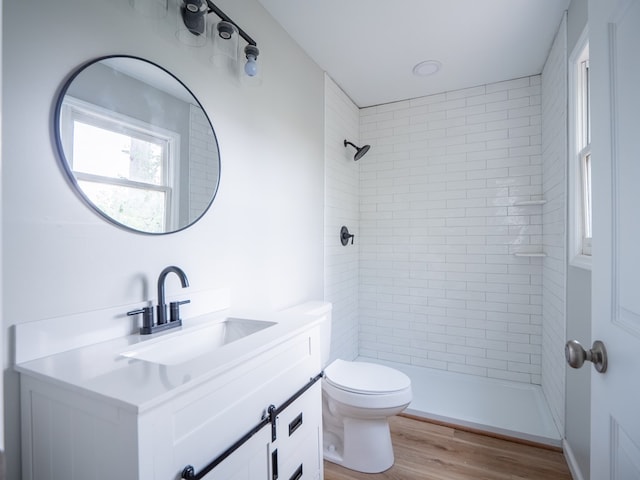103 W Moore St, Valdosta, GA 31602 - full bath featuring vanity, wood finished floors, toilet, and a tile shower