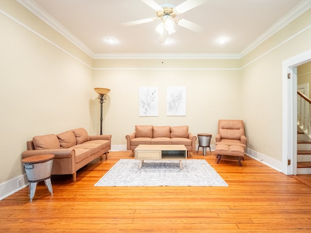 103 W Moore St, Valdosta, GA 31602 - living area with crown molding, stairway, ceiling fan, light wood-style flooring, and baseboards