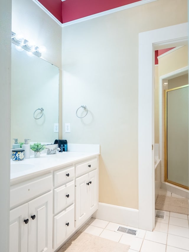 103 W Moore St, Valdosta, GA 31602 - full bath with a shower stall, double vanity, tile patterned flooring, a tub to relax in, and baseboards