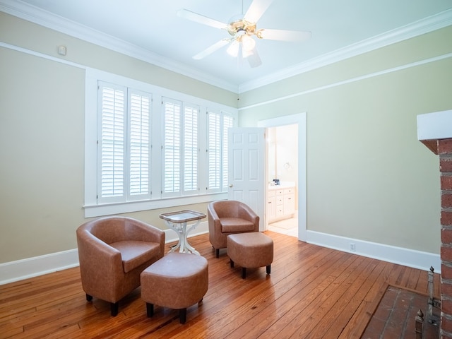 103 W Moore St, Valdosta, GA 31602 - sitting room with baseboards, hardwood / wood-style floors, ceiling fan, and crown molding
