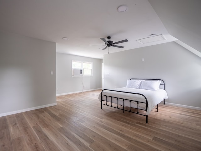 103 W Moore St, Valdosta, GA 31602 - bedroom with light wood finished floors, a ceiling fan, baseboards, and lofted ceiling