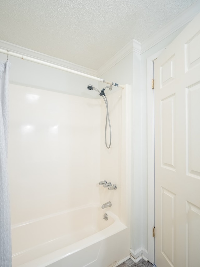 103 W Moore St, Valdosta, GA 31602 - full bath with ornamental molding, shower / tub combo with curtain, and a textured ceiling