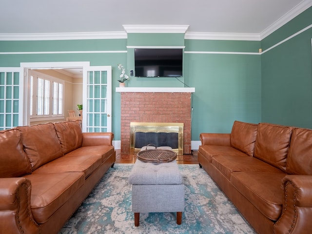 103 W Moore St, Valdosta, GA 31602 - living area with ornamental molding, a fireplace, baseboards, and wood finished floors