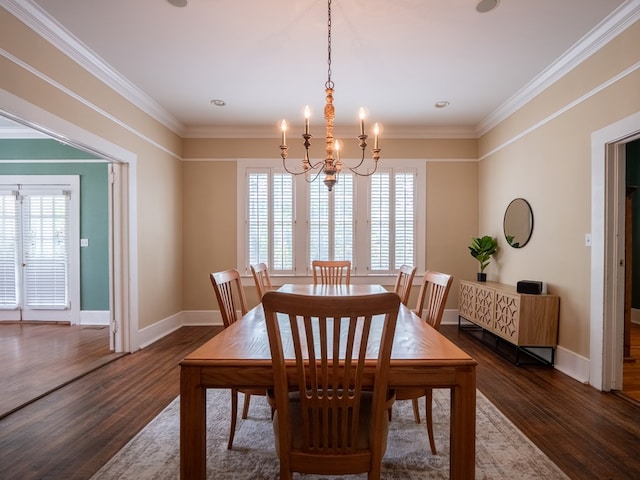 103 W Moore St, Valdosta, GA 31602 - dining room with a chandelier, healthy amount of natural light, dark wood-style flooring, ornamental molding, and baseboards