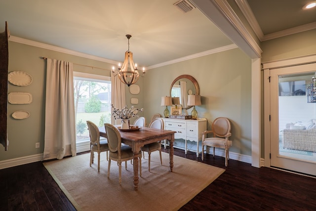 7351 Woodbend Trl, Hahira, GA 31632 - dining area with a chandelier, dark wood finished floors, and ornamental molding