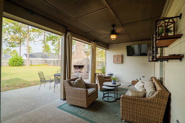 7351 Woodbend Trl, Hahira, GA 31632 - sunroom featuring a ceiling fan and an outdoor living space with a fireplace