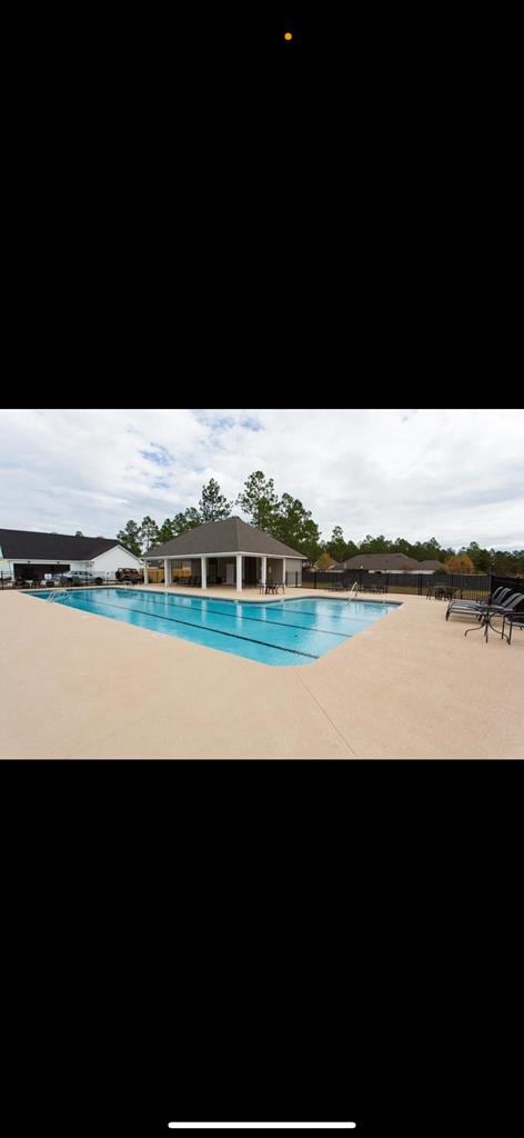7351 Woodbend Trl, Hahira, GA 31632 - community pool featuring a patio