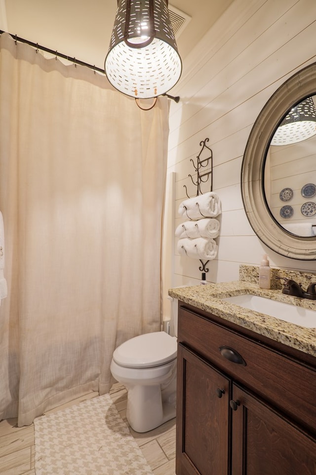 7351 Woodbend Trl, Hahira, GA 31632 - bathroom with vanity, wood walls, and curtained shower