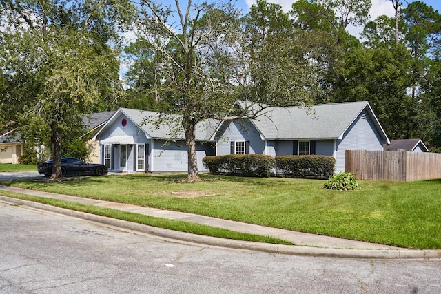 single story home featuring a front yard