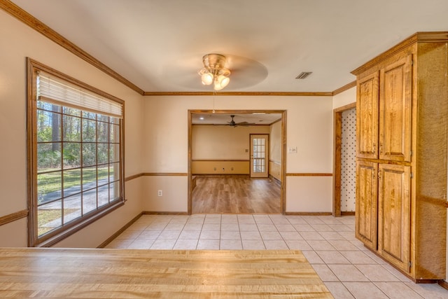 living room with ornamental molding, a textured ceiling, and light hardwood / wood-style flooring