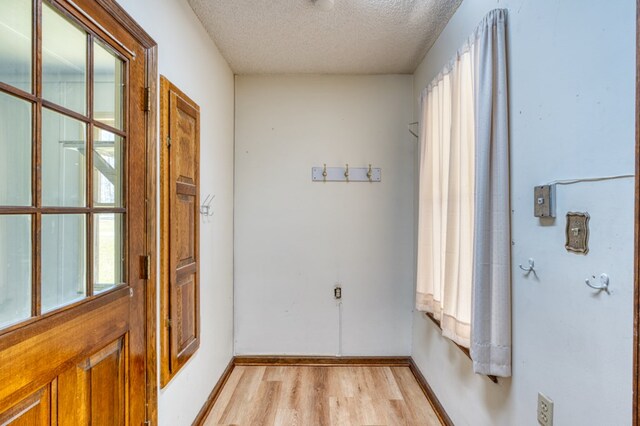 staircase with hardwood / wood-style flooring and ornamental molding