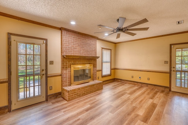 kitchen featuring kitchen peninsula, light tile patterned floors, ornamental molding, and appliances with stainless steel finishes