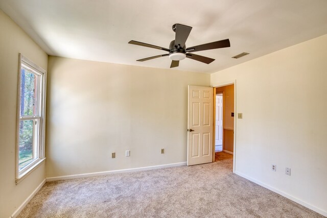 carpeted bedroom featuring ceiling fan and a textured ceiling