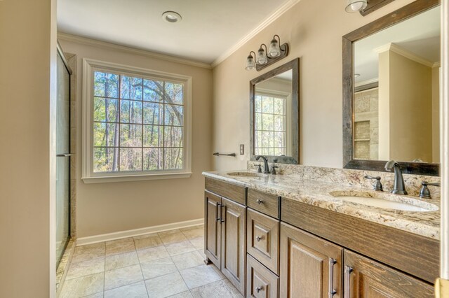 bathroom featuring vanity, tile patterned floors, and ornamental molding