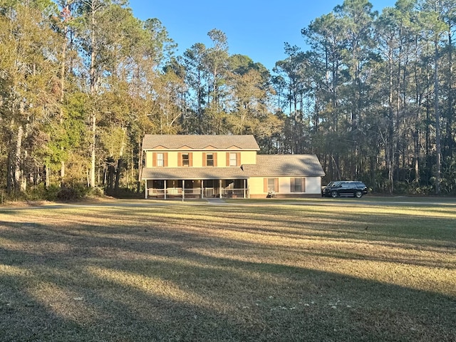 view of front of home featuring a front yard and covered porch