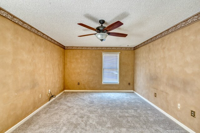 bedroom with ceiling fan, light colored carpet, and a textured ceiling