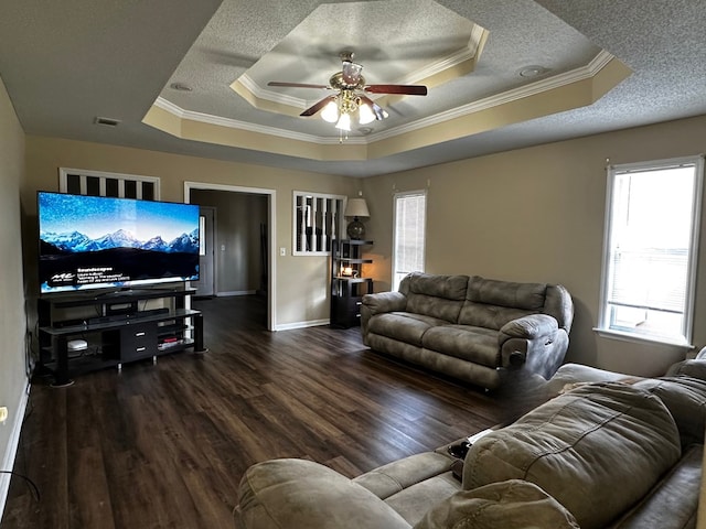 2761 Tyndall Dr, Valdosta, GA 31602 - living room with a tray ceiling, crown molding, a ceiling fan, wood finished floors, and a textured ceiling
