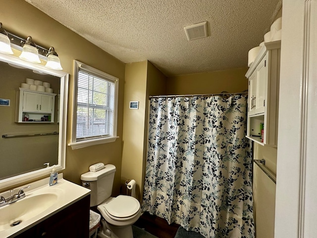 2761 Tyndall Dr, Valdosta, GA 31602 - full bathroom with vanity, a textured ceiling, and curtained shower