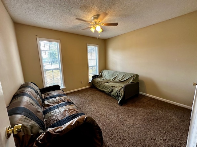 2761 Tyndall Dr, Valdosta, GA 31602 - carpeted living area featuring a textured ceiling and ceiling fan