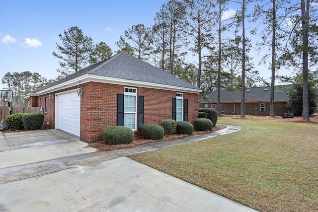 view of home's exterior with a garage and a yard