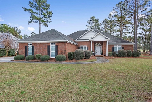 ranch-style home with a front yard