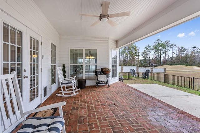 view of patio featuring french doors and ceiling fan