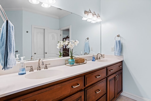 bathroom with vanity and ornamental molding