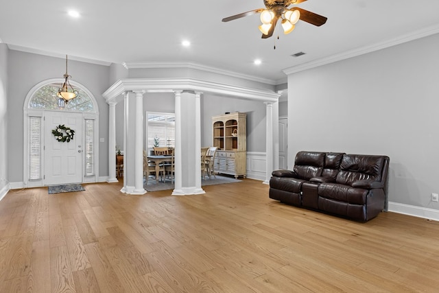 foyer with light hardwood / wood-style flooring, ceiling fan, and crown molding