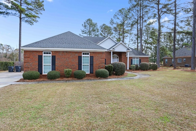 ranch-style home featuring a front yard