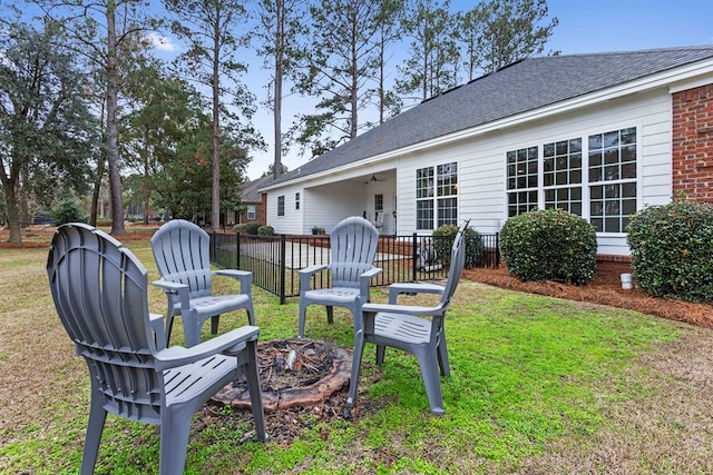 view of yard with a fire pit