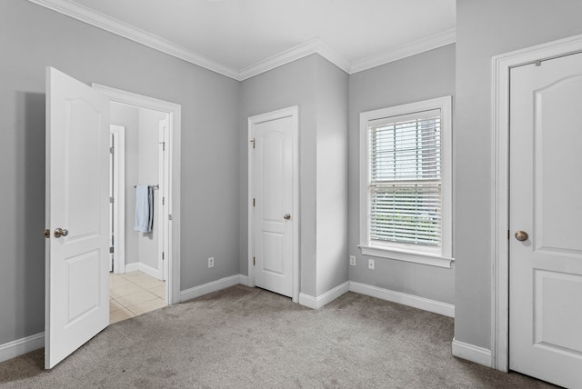 unfurnished bedroom with light colored carpet and ornamental molding